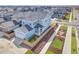 Aerial view of a blue house, showcasing its landscaping and surrounding neighborhood at 21209 E 62Nd Ave, Aurora, CO 80019