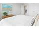 Bright bedroom featuring a neutral palette, modern art, and a comfortable white bed at 21209 E 62Nd Ave, Aurora, CO 80019