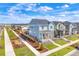 Charming two-story home with blue siding, a covered porch, and landscaped yard at 21209 E 62Nd Ave, Aurora, CO 80019