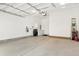 Spacious and bright two-car garage with ample storage and work space at 21209 E 62Nd Ave, Aurora, CO 80019