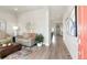 Inviting living room with modern decor, comfortable seating, and an open layout at 21209 E 62Nd Ave, Aurora, CO 80019
