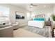 Bright main bedroom featuring neutral decor, a ceiling fan, and oversized windows at 21209 E 62Nd Ave, Aurora, CO 80019