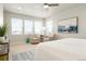 Bright main bedroom featuring neutral decor and large windows with light streaming through at 21209 E 62Nd Ave, Aurora, CO 80019