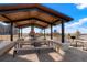 Covered picnic pavilion features stone accents, built-in seating, and BBQ grills at 21209 E 62Nd Ave, Aurora, CO 80019