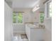 Bright bathroom featuring a double vanity with granite countertops and a shower with a curtain at 1644 S Garfield St, Denver, CO 80210