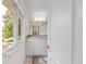 Bathroom boasts double vanity with granite countertops and natural light from nearby windows at 1644 S Garfield St, Denver, CO 80210