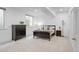 Modern bedroom with neutral carpet, a window, dark furniture, and ample natural light at 1644 S Garfield St, Denver, CO 80210