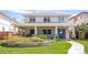 Charming two-story home featuring stone accents, a covered porch with seating, and a beautifully landscaped front yard at 1644 S Garfield St, Denver, CO 80210