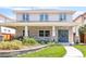 Beautiful home featuring stone accents, a covered porch with seating, and a landscaped front yard at 1644 S Garfield St, Denver, CO 80210