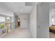 Bright hallway features neutral decor, carpeted floor, and open railing overlooking the floor below at 1644 S Garfield St, Denver, CO 80210