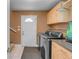 Functional laundry room boasts modern appliances, ample cabinet space, and a convenient utility sink at 1644 S Garfield St, Denver, CO 80210