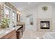 Main bathroom boasts double sinks, stone accents, and fireplace overlooking the bathtub at 1644 S Garfield St, Denver, CO 80210