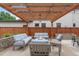 Beautiful outdoor patio with pergola, string lights, fire pit, and comfortable seating at 1644 S Garfield St, Denver, CO 80210