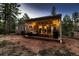 Inviting back patio with comfortable seating, string lights, and seamless indoor-outdoor flow at 6100 Apache Dr, Larkspur, CO 80118