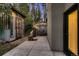 Backyard featuring a storage shed, wood pile, and outdoor seating area on a concrete patio at 6100 Apache Dr, Larkspur, CO 80118