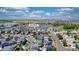 Aerial view of neighborhood in Denver with neatly lined streets and modern homes, many equipped with solar panels at 18651 E 53Rd Ave, Denver, CO 80249
