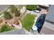 Aerial view of a fenced backyard with a well-manicured lawn, hot tub, and patio furniture at 18651 E 53Rd Ave, Denver, CO 80249