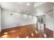 Spacious finished basement with hardwood floors, recessed lighting, and walkout access to the backyard at 18651 E 53Rd Ave, Denver, CO 80249