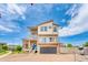 Beautiful multi-story home with a modern design, attached garage, and a well-maintained brick driveway at 18651 E 53Rd Ave, Denver, CO 80249