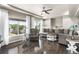 Bright and inviting living room featuring hardwood floors, a comfortable sectional, and large windows at 18651 E 53Rd Ave, Denver, CO 80249