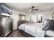 Serene main bedroom with ample natural light, hardwood floors, and stylish furnishings at 18651 E 53Rd Ave, Denver, CO 80249