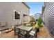 Charming backyard with a dining set and beautiful landscaping, perfect for outdoor gatherings at 6237 Stable View St, Castle Pines, CO 80108