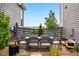 Cozy backyard patio features a dining table and chairs, perfect for outdoor entertaining at 6237 Stable View St, Castle Pines, CO 80108