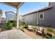 Landscaped backyard with gravel, mature plants, and chairs at 6237 Stable View St, Castle Pines, CO 80108