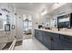 Modern bathroom with walk-in shower, dual vanity, and contemporary fixtures at 6237 Stable View St, Castle Pines, CO 80108