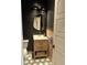 Modern bathroom featuring unique tile flooring, vanity with gold fixtures, and stylish lighting at 6237 Stable View St, Castle Pines, CO 80108