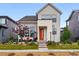 Inviting home featuring a bright orange door and cozy seating on the covered front porch at 6237 Stable View St, Castle Pines, CO 80108