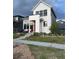 Charming two-story home featuring modern design elements and beautifully landscaped front yard at 6237 Stable View St, Castle Pines, CO 80108