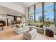 Bright and airy living room with large windows offering panoramic views of the surrounding landscape at 6237 Stable View St, Castle Pines, CO 80108
