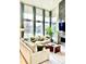 Bright living room with high ceilings, large windows, and stylish decor at 6237 Stable View St, Castle Pines, CO 80108