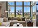 Cozy living room with abundant natural light with comfortable seating and stylish decor at 6237 Stable View St, Castle Pines, CO 80108