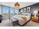 Beautiful main bedroom with modern decor, large windows, and stylish furniture at 6237 Stable View St, Castle Pines, CO 80108