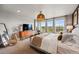 Spacious main bedroom with large windows and scenic views at 6237 Stable View St, Castle Pines, CO 80108