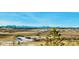 Scenic mountain view over grasslands with walking trails in a vibrant community with a clear blue sky at 6237 Stable View St, Castle Pines, CO 80108