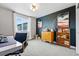 Office with a modern desk, vintage dresser, and artwork, creating an inspiring workspace at 6237 Stable View St, Castle Pines, CO 80108