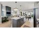 Spacious open concept integrating the kitchen, dining, and living areas for seamless living at 6237 Stable View St, Castle Pines, CO 80108