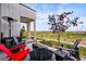 Inviting outdoor living space with a cozy seating area and beautiful views of the surrounding landscape at 6237 Stable View St, Castle Pines, CO 80108