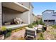 Covered patio with a grill and comfortable seating, ideal for outdoor cooking and lounging at 6237 Stable View St, Castle Pines, CO 80108