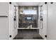 Luxurious walk-in shower featuring dual shower heads, tiled walls, and glass enclosure at 6237 Stable View St, Castle Pines, CO 80108
