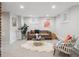 Finished basement with a sofa, decorative chair, and recessed lighting at 660 S Clarkson St, Denver, CO 80209