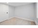 Empty basement featuring neutral carpeting and white walls at 660 S Clarkson St, Denver, CO 80209