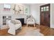 Bright living room with hardwood floors, fireplace, modern decor, and natural light at 660 S Clarkson St, Denver, CO 80209