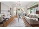 Spacious living room featuring hardwood floors, neutral decor, and an open layout at 660 S Clarkson St, Denver, CO 80209