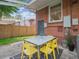 A cozy patio features a table with seating, ideal for outdoor dining and relaxation at 660 S Clarkson St, Denver, CO 80209