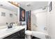 Functional bathroom featuring a shower-tub combo, sleek vanity, and stylish decor, providing a comfortable and practical space at 16001 E Alaska Pl # 12, Aurora, CO 80017