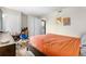 Comfortable bedroom with a spacious closet, in-unit laundry, and stylish decor, offering a convenient and cozy living space at 16001 E Alaska Pl # 12, Aurora, CO 80017